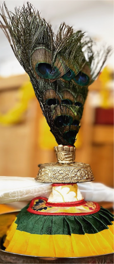 Monks in ceremonial robes during a puja at the centre