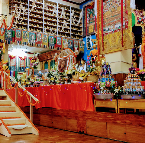 A practitioner in seated meditation in the shrine room